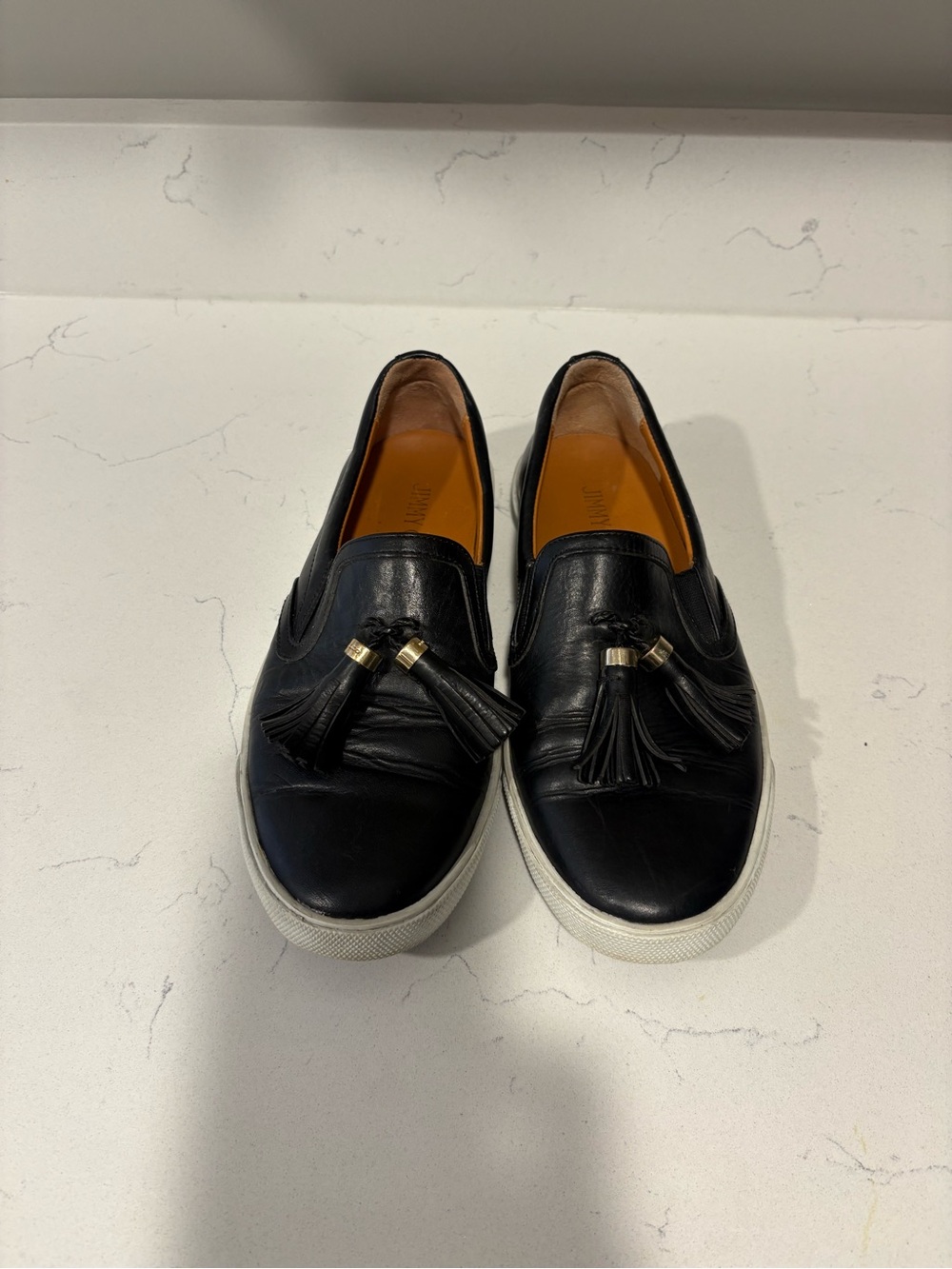 Jimmy Choo Black Leather Tassel Slip-On Sneakers with White Soles